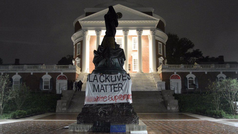 Picture shows the statue of Thomas Jefferson covered in Charlottesville