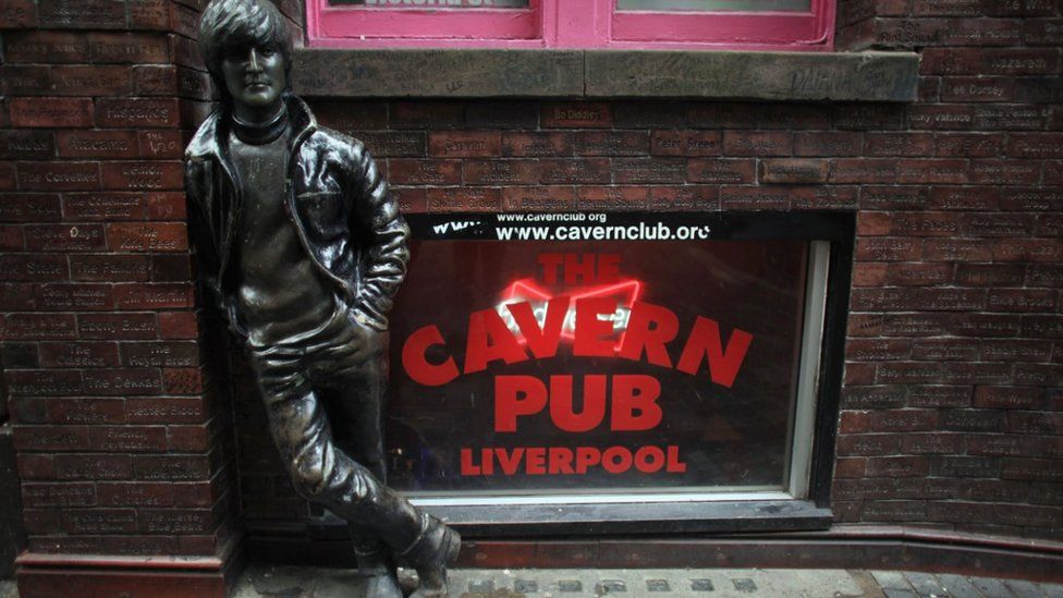 A statue of John Lennon stands outside the Cavern Pub in Mathew Street on January 27, 2012 in Liverpool, England. With six months to go until the opening ceremony of the London 2012 Olympic games Britain's tourist industry is gearing up to cater for the influx of athletes, officials and visitors.