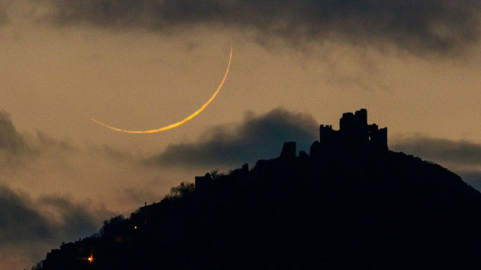 cresecent moon over a castle in Italy