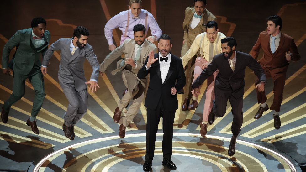 Jimmy Kimmel gets danced off the stage while hosting the Oscars show at the 95th Academy Awards in Hollywood, Los Angeles, California, U.S., March 12, 2023