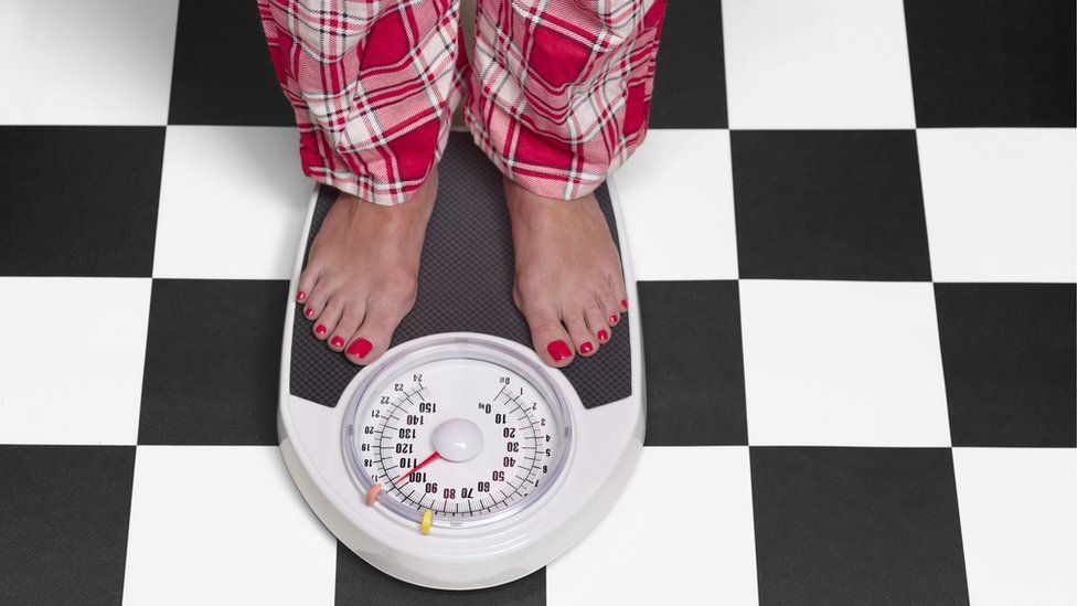 Person standing on scales