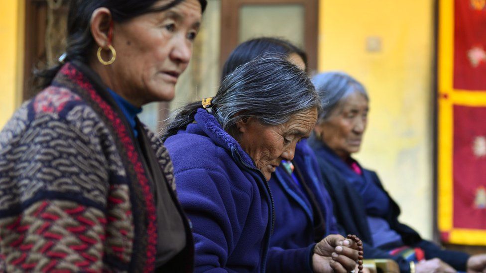 Nepalese women pray in the monastery where the remains of Jigme Dorje Palbar Bista, the last king of former Himalayan kingdom of Upper Mustang, is kept, 16 December 2016