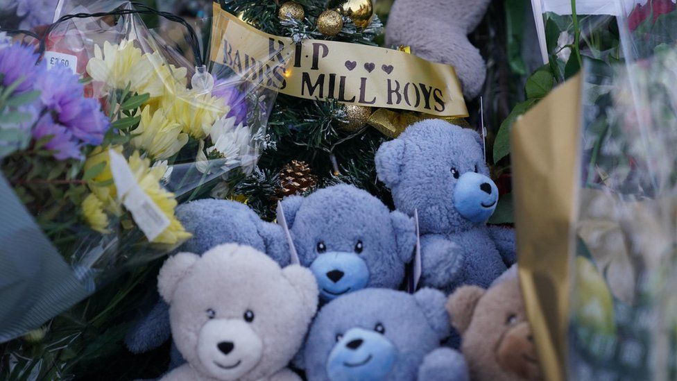 Soft toys left at the scene with a note reading 'RIP Babbs Mill Boys'