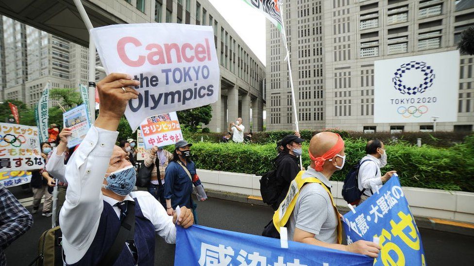People stage a demonstration against Tokyo Olympics in front of the Tokyo Metropolitan Government