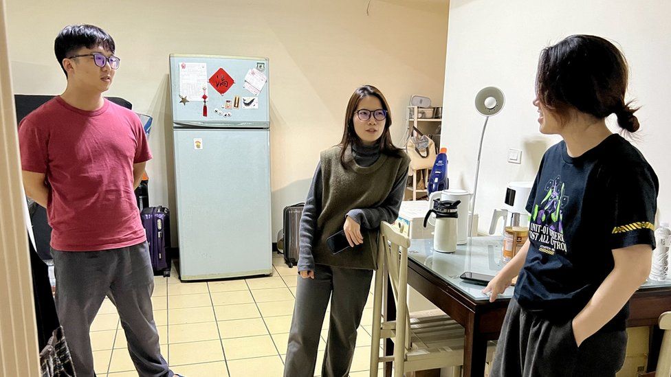 Ziwei, her husband Wenjing and friend Kaili in a flat without sewage smells or orange walls