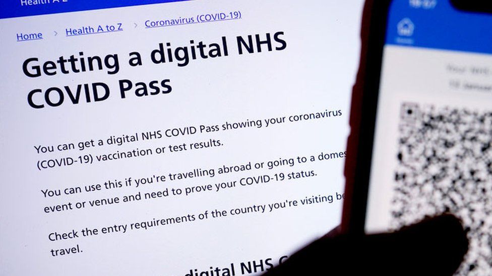 A person's NHS COVID domestic Pass is displayed on a smartphone screen within the NHS App