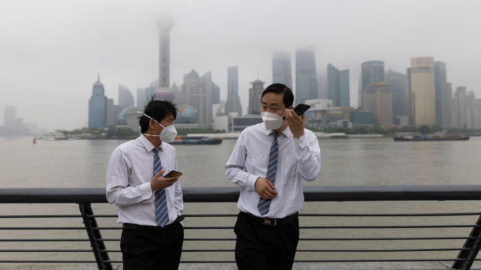 People are seen with face masks at The Bund on June 01, 2022 in Shanghai, China.