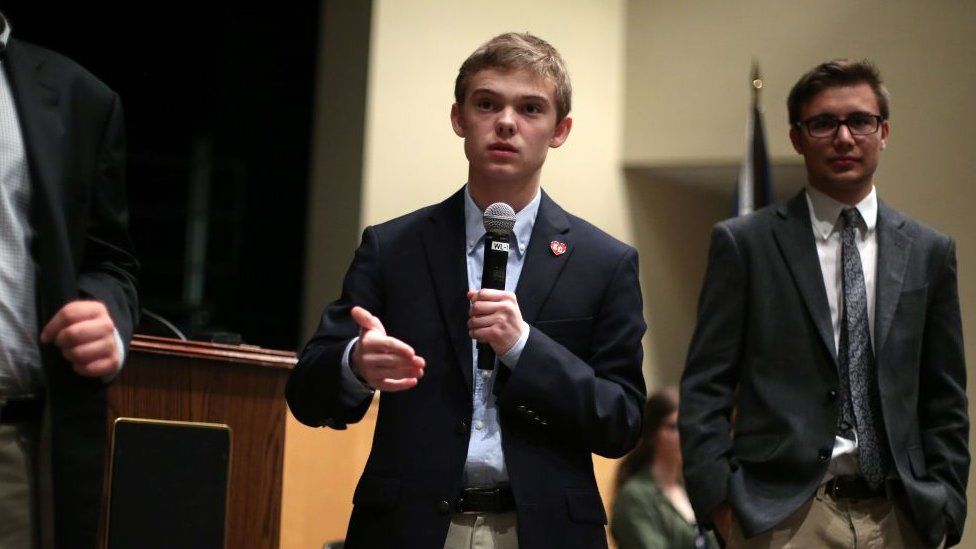 Tyler Ruzich (C), 17, of Prairie Village, Kansas, speaks at a forum.
