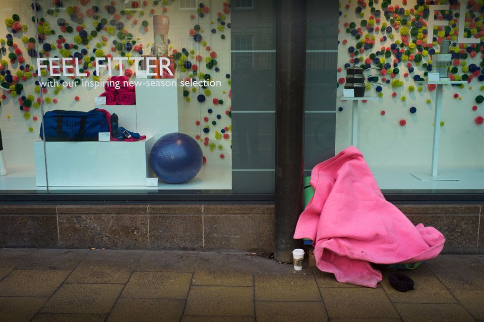 Homeless person outside John Lewis in Cambridge