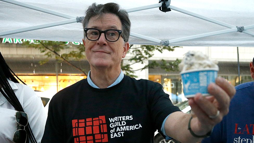 Stephen Colbert serves ice cream as Animation writers, who are members of the Writers Guild of America, continue to picket in front of Warner Brothers/Discovery on July 25, 2023 in New York City