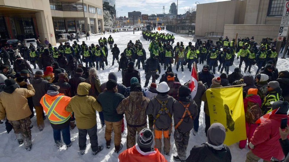 Police confront demonstrators against Covid-19 mandates in Ottawa on February 18, 2022