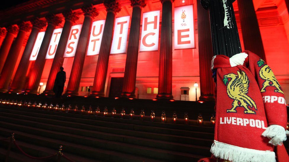 St George's Hall Liverpool is lit up in memorial after the conclusions were delivered