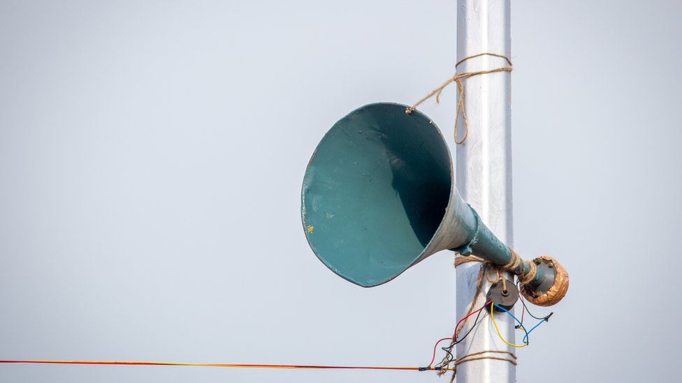 A loudspeaker attached to the lamp post along the Marina Beach for public announcements, Chennai, India