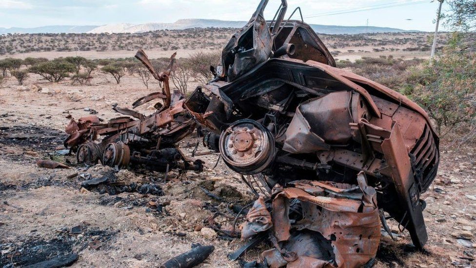 A damaged military vehicle lies on the side of the road north of Mekele, the capital of Tigray on February 26, 2021.