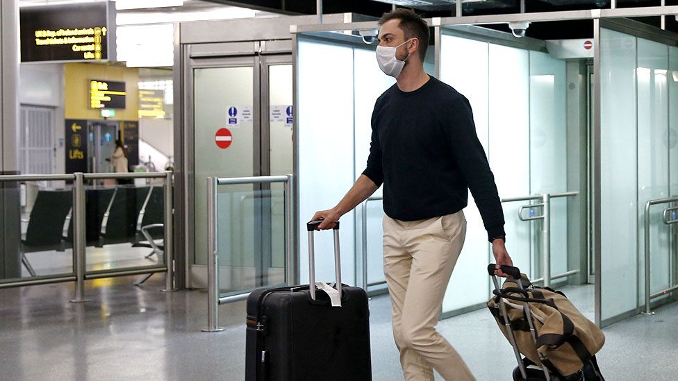 A man walking through the airport