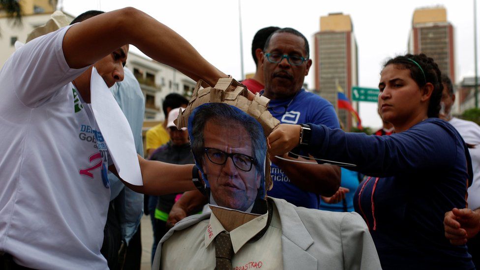 Government supporters prepare an effigy of OAS head Luis Almagro in Caracas