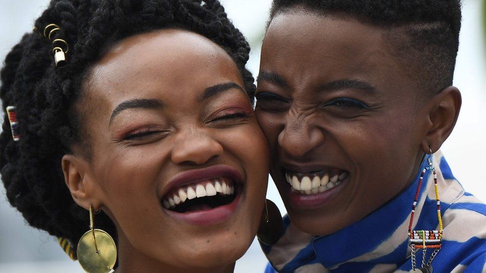 Kenyan actress Sheila Munyiva (L) and Kenyan actress Samantha Mugatsia pose on May 9, 2018 during a photocall for the film "Rafiki" during the 71st edition of the Cannes Film Festival in Cannes, southern France