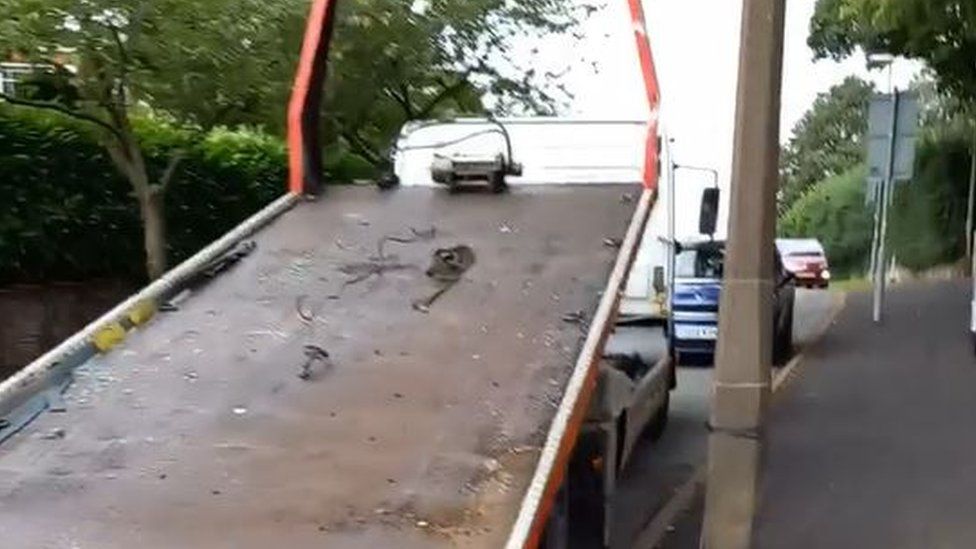 Woman reverses own car off truck to foil Wolverhampton theft - BBC News