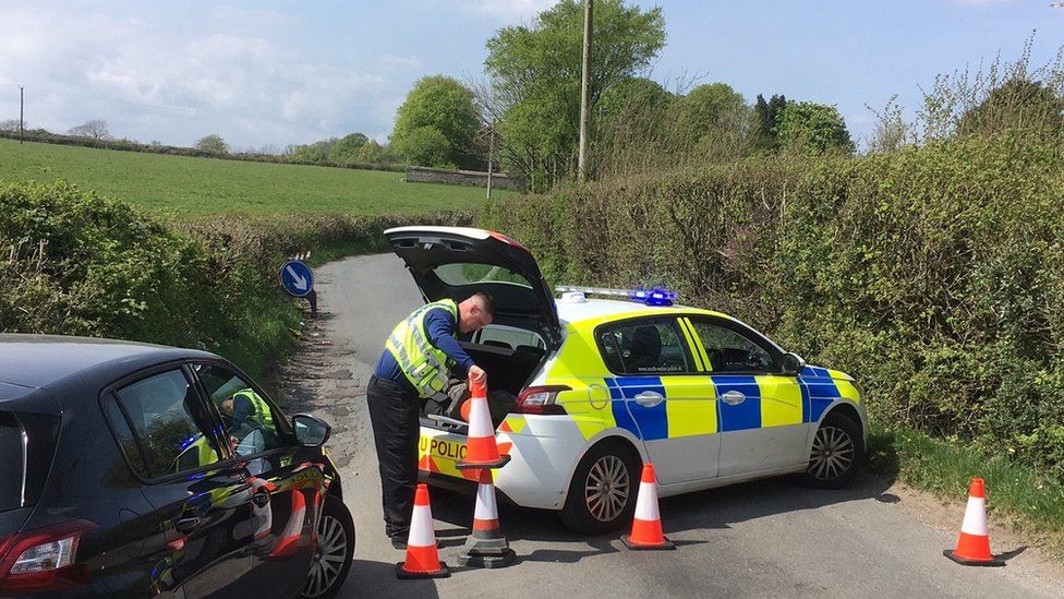 police officer laying cones in Heol Ddu