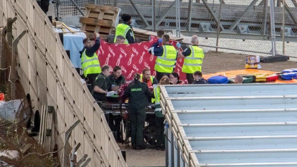 People on stretchers brought ashore at Dover