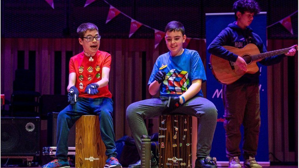 The youth rock group Rubik's Cube performing on stage