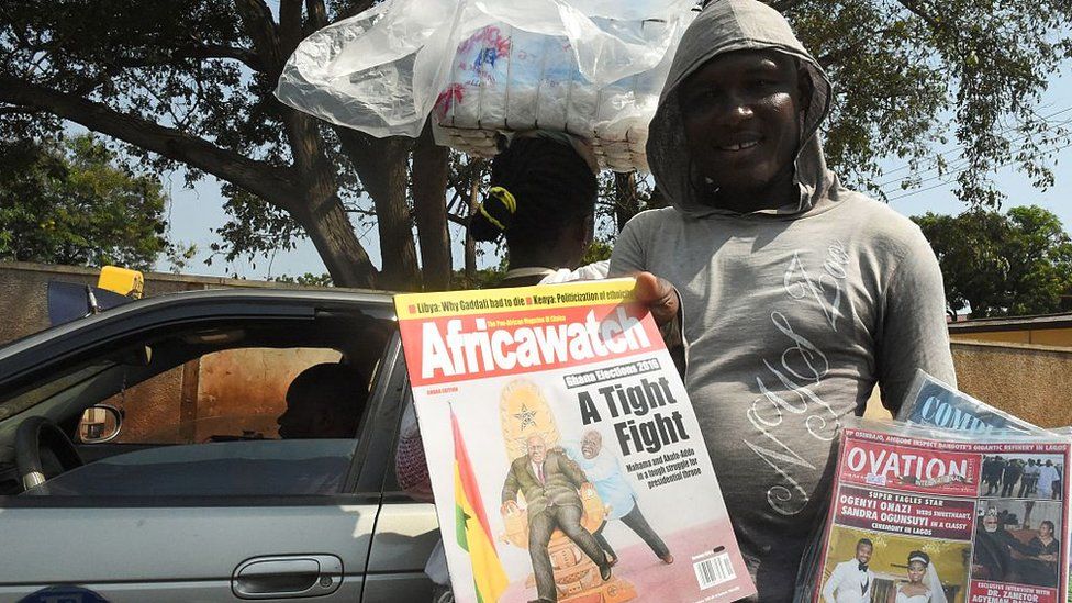 A news magazine street vendor