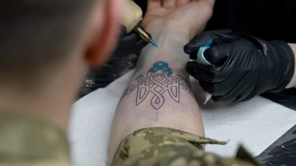 Man getting tattoo
