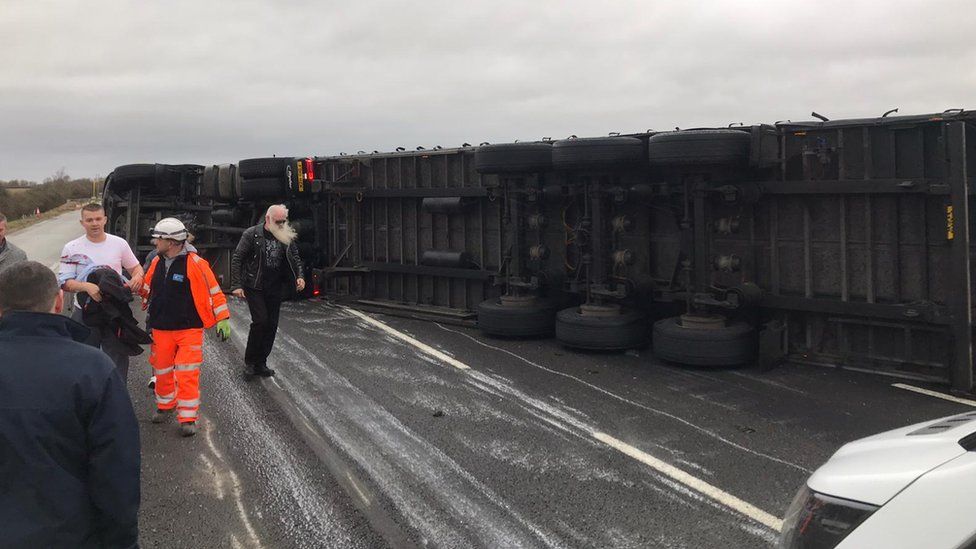 An overturned lorry on the M1