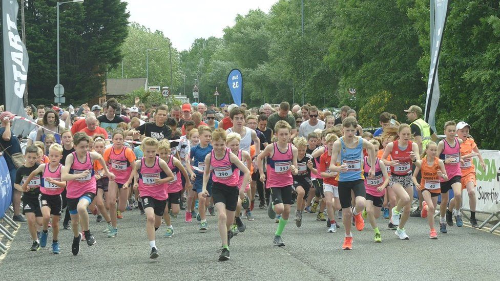 Children and adults set off on fun run