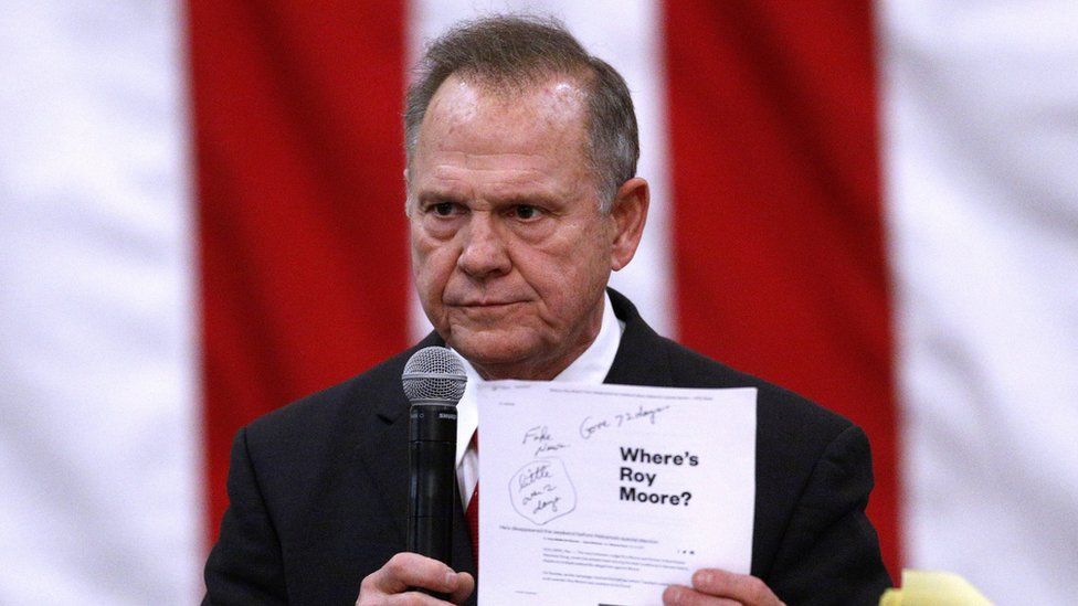Roy Moore speaks at a final rally in Midland City, Alabama on Monday