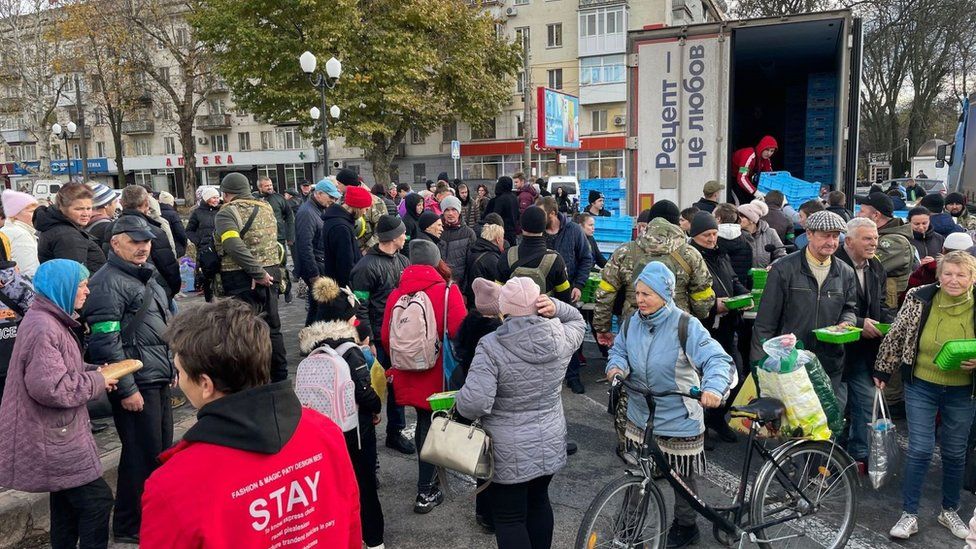 Kherson residents queue for donated packets of chickenhearted  from different  region.