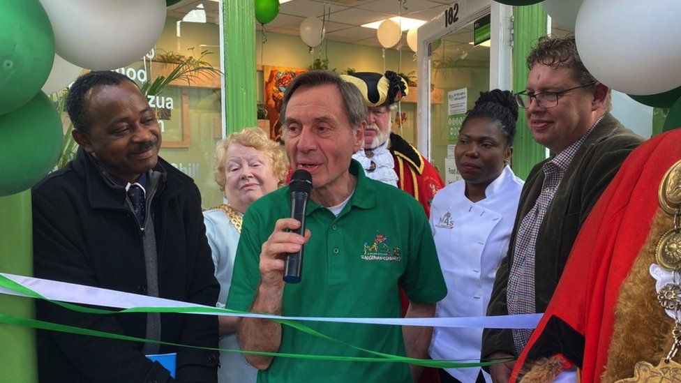 Image of Dave, Maggie, and others attending the opening ceremony