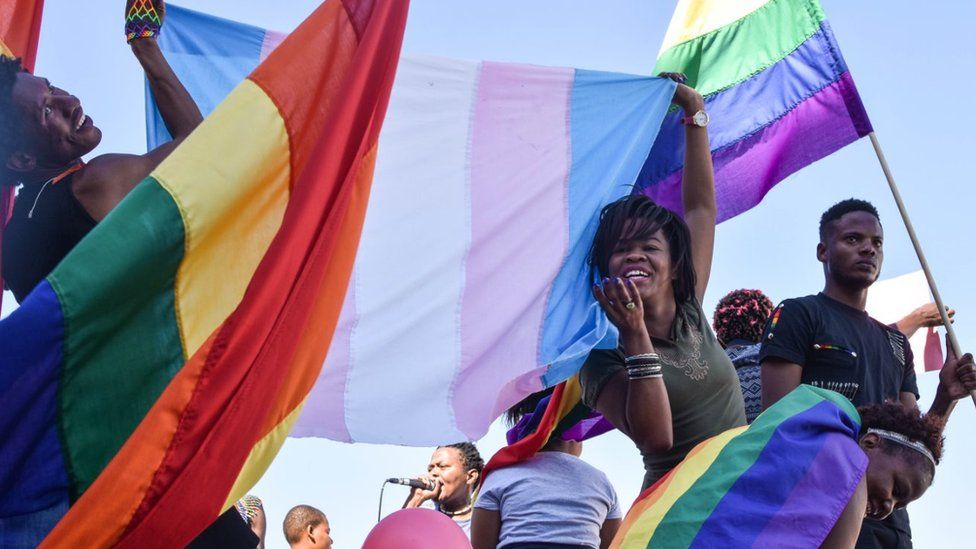 Dozens of people cheer and dance as they take part in the Namibian Lesbians, Gay, Bisexual and Transexual (LGBT) community pride Parade in the streets of the Namibian Capitol on July 29, 2017 in Windhoek.