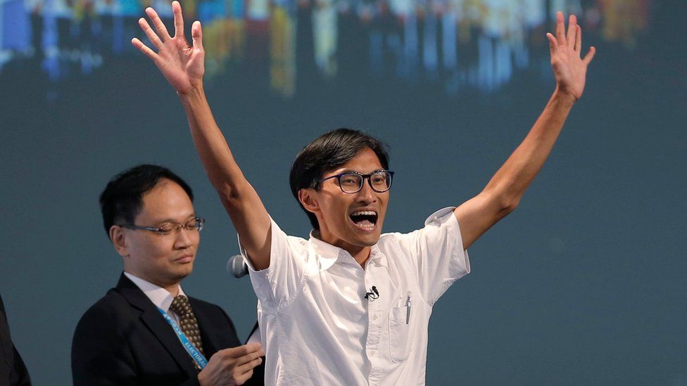 Radical activist candidate Eddie Chu Hoi-dick, right, celebrates after winning a seat at the legislative council elections in Hong Kong, Monday, Sept. 5, 2016