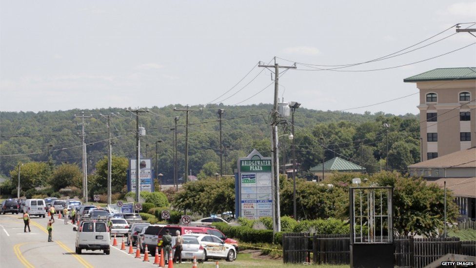 Police work the crime scene at Bridgewater Plaza on Smith Mountain Lake on 26 August 2015 in Moneta, Virginia.