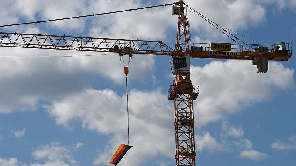 Construction crane with German flag