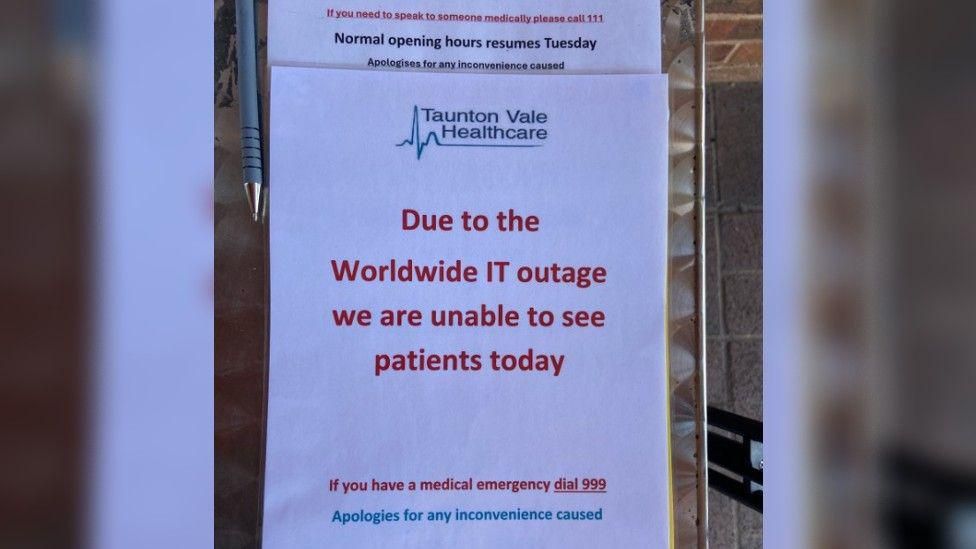 A notice outside a GP surgery saying patients cannot be seen due to the outage