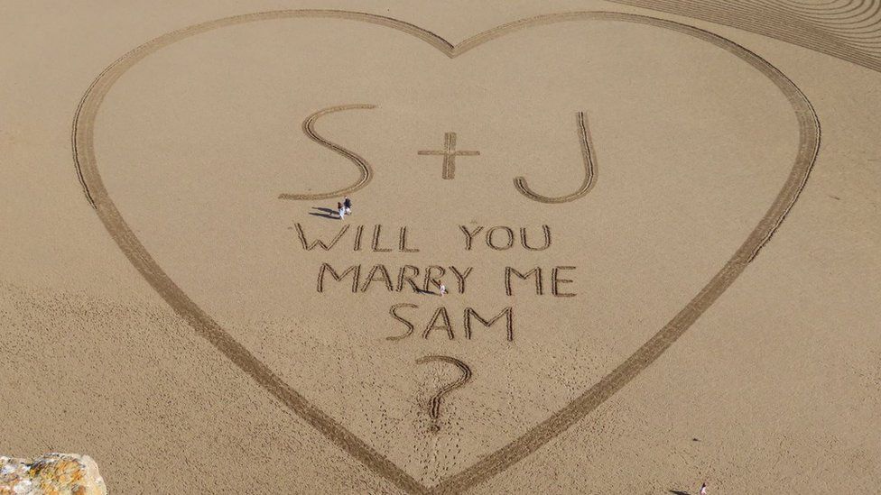 a giant love-heart drawn in sand on brean beach