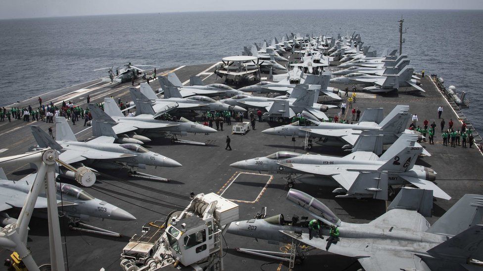 Handout photo from US Navy shows fighter jets on the deck of the USS Abraham Lincoln in the Arabian Sea on 19 May 2019