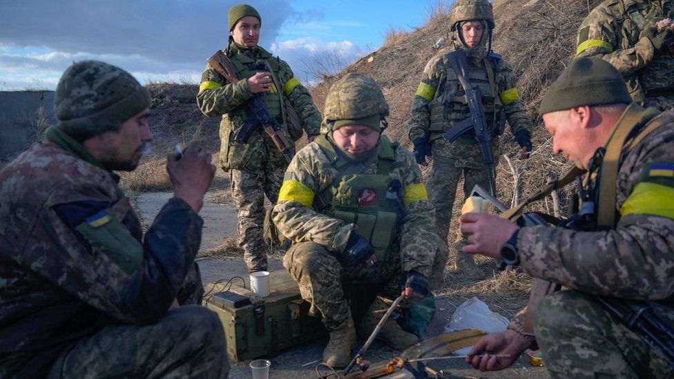 Ukrainian servicemen have a meal at the military airbase Vasylkiv in the Kyiv region