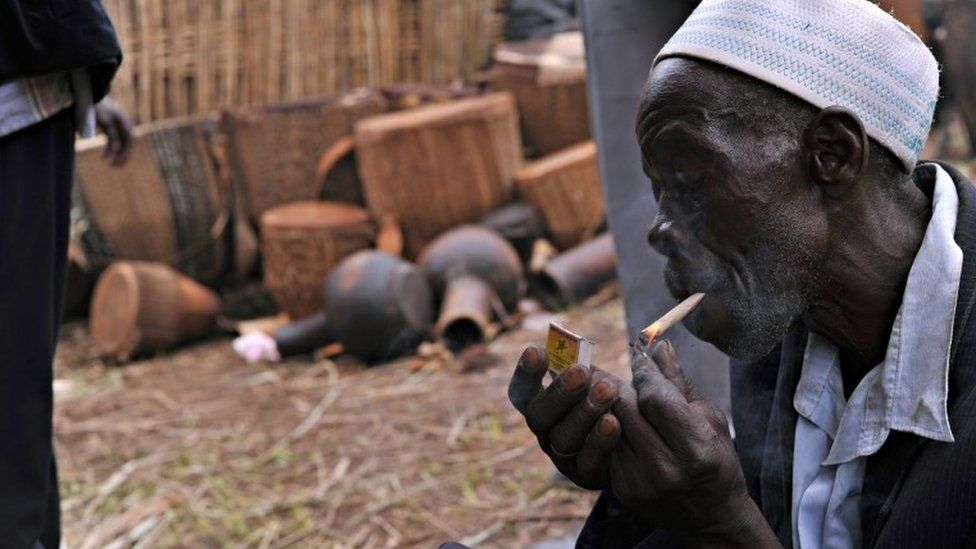 Ugandan man smoking