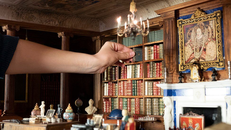 Books being added to the Dolls' House Library.