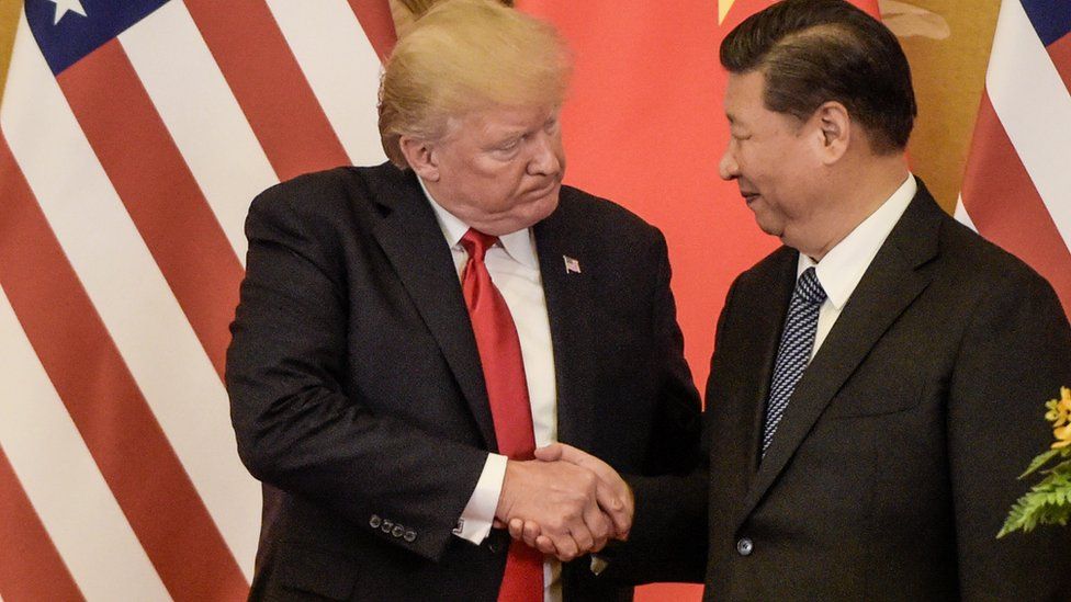 US President Donald Trump shakes hand with China's President Xi Jinping