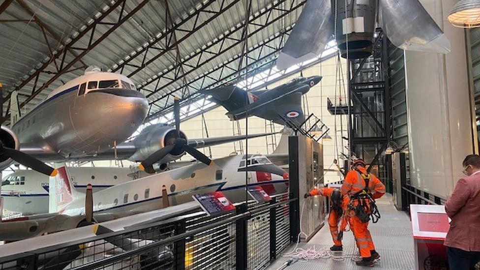 Workers at the RAF Cosford museum