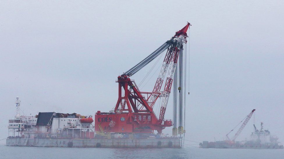 A giant crane that will lift up the sunken Sewol ferry is seen during a salvage project in the sea off Jindo on June 12, 2016.
