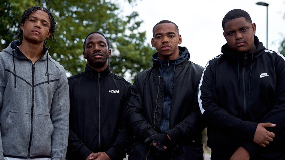Percelle Ascott, Konan, Joivan Wade and Deno Driz posing for a behind the scenes shot