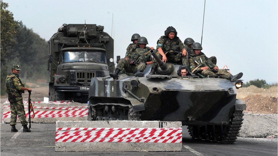 Russian armoured vehicle passing at a checkpoint on the Gori-Tbilisi road near the village of Khurvaleti on August 22, 2008.