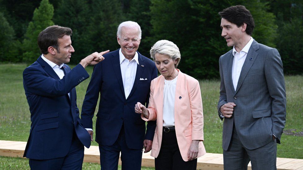 France's President Emmanuel Macron, U.S President Joe Biden, European Commission President Ursula von der Leyen and Canada's Prime Minister Justin Trudeau chat after posing for a photo during the G7 summit in Germany in 2022