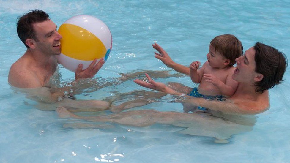 A family at a British Naturism swimming event