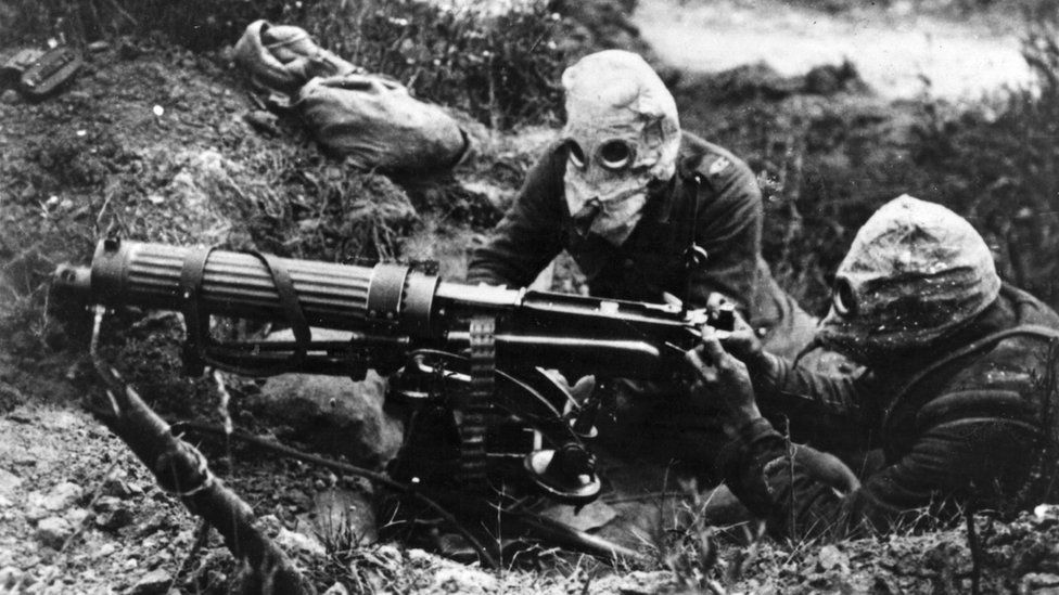 Gas-masked men of the British Machine Gun Corps with a Vickers machine gun during the first battle of the Somme